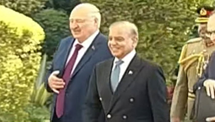 Belarusian President Alexander Lukashenko receives guard of honor at PM's House