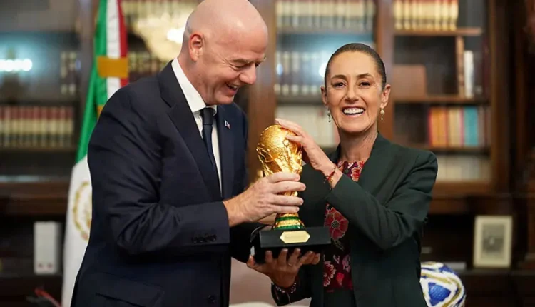 Mexican President Claudia Sheinbaum and FIFA's Gianni Infantino smile with the World Cup trophy