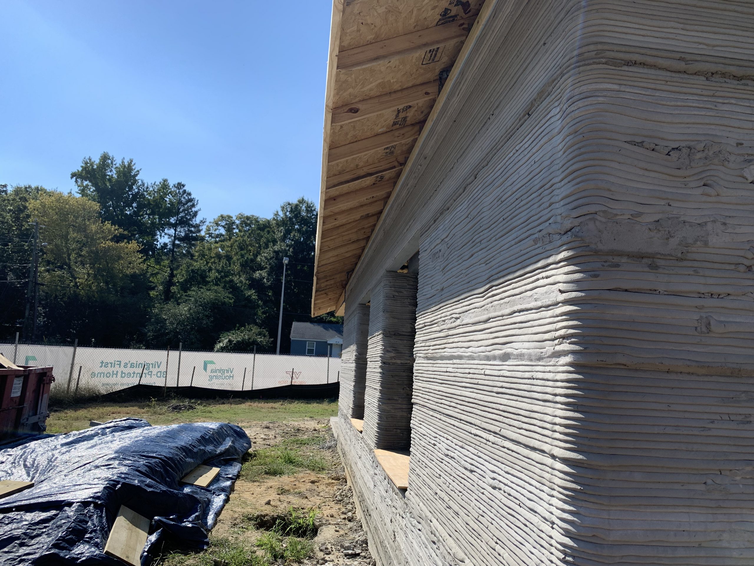 AI-powered robotic arms assemble sustainable timber frames in a UK factory, speeding up affordable and eco-friendly home construction