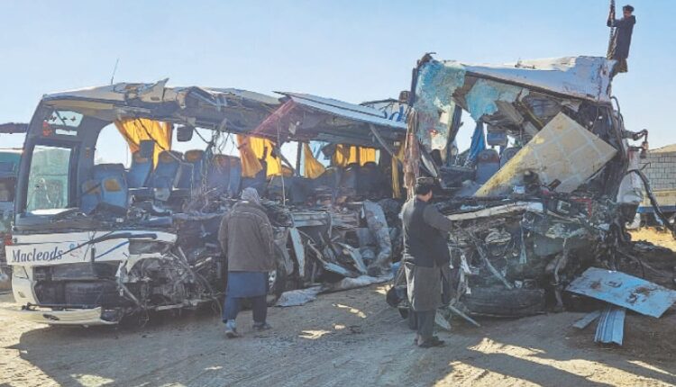 Rescue workers at the site of deadly bus accidents in central Afghanistan.