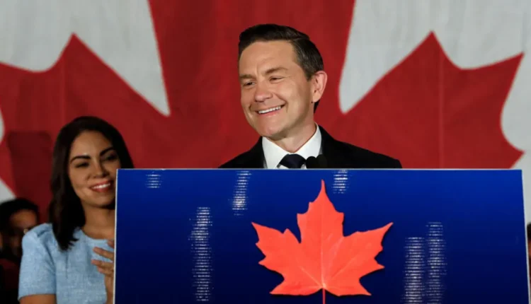 Pierre Poilievre smiling and addressing supporters after winning Alberta by-election, projected to return to Canadian Parliament.