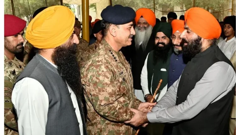 Pakistan Army Chief General Asim Munir meeting with Sikh community members in a flood-affected village.