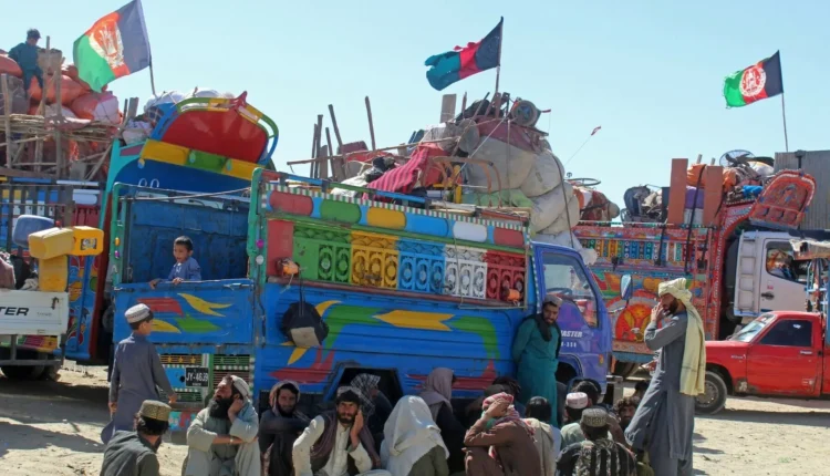 Local elders listen to a Khyber official explain new visa rules for Afghan citizens.
