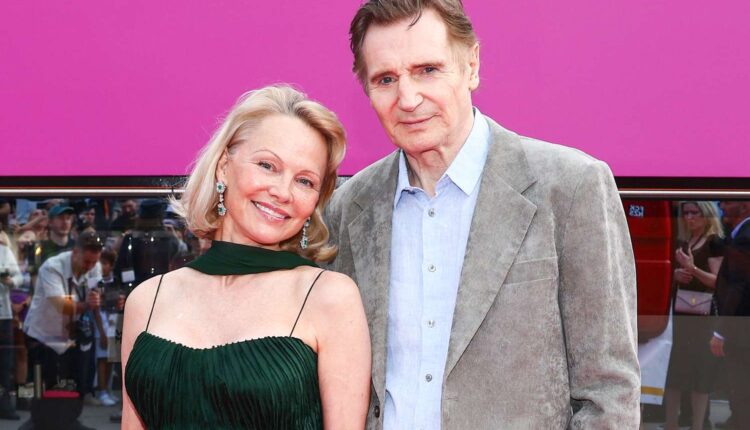 Liam Neeson and Pamela Anderson smile together on the red carpet at The Naked Gun premiere, sharing a tender moment that fueled romance speculation.