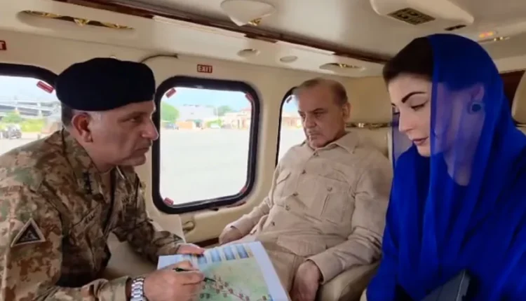 Prime Minister Shehbaz Sharif surveys flood damage in Punjab from a helicopter.