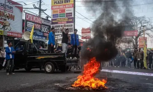 Indonesian soldiers on patrol in Jakarta during a time of widespread public protests.