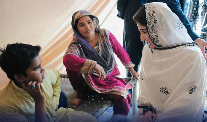 Punjab Chief Minister Maryam Nawaz speaking with a family at a well-organized flood relief camp in Multan.