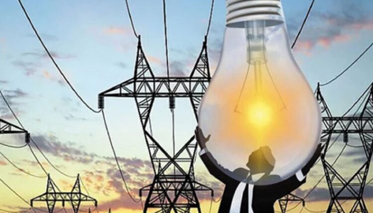 Residents of Varaswadi village smiling joyfully as their homes are lit by electric bulbs for the first time.