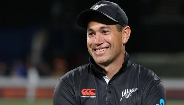 New Zealand cricketer Ross Taylor smiling in his black kit, holding a bat