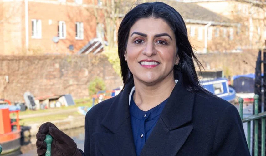 Portrait of Shabana Mahmood, the UK's first Muslim Home Secretary, smiling confidently.