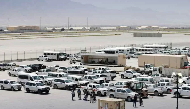 Aerial view of the large, concrete runway and buildings at Bagram Air Base in Afghanistan.
